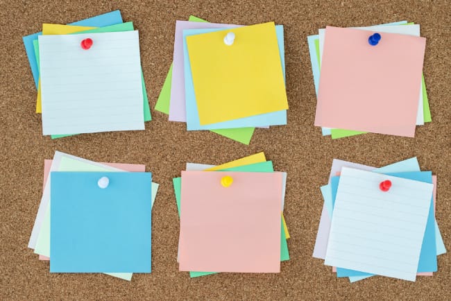 Colorful sticky notes representing digital note-taking and HIPAA compliance questions for Evernote.