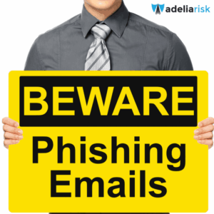 Person holding a large yellow sign that says "BEWARE Phishing Emails," warning viewers about the dangers of spear phishing in email communication.